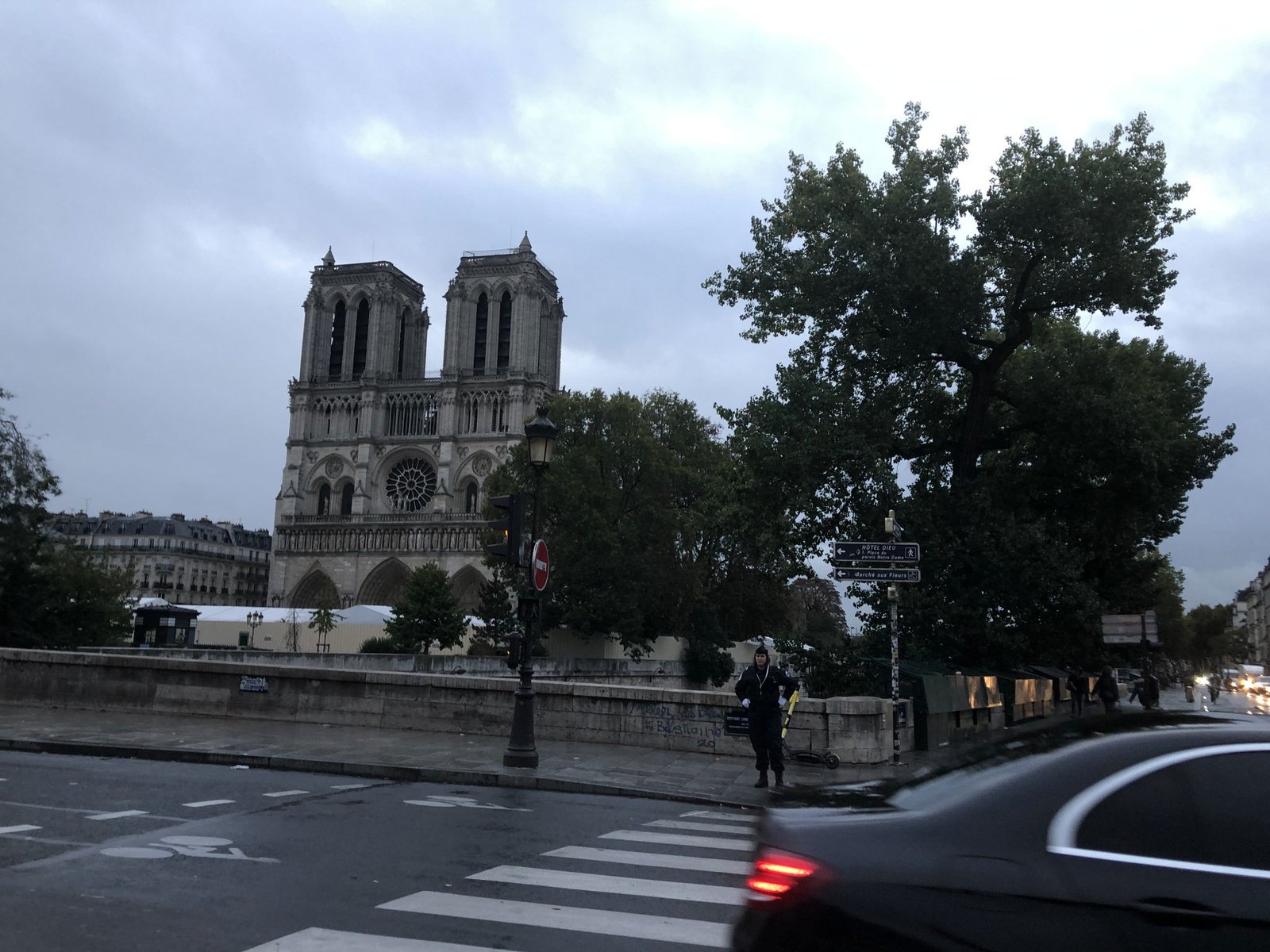 Image of Notre Dame cathedral in early morning under an overcast sky